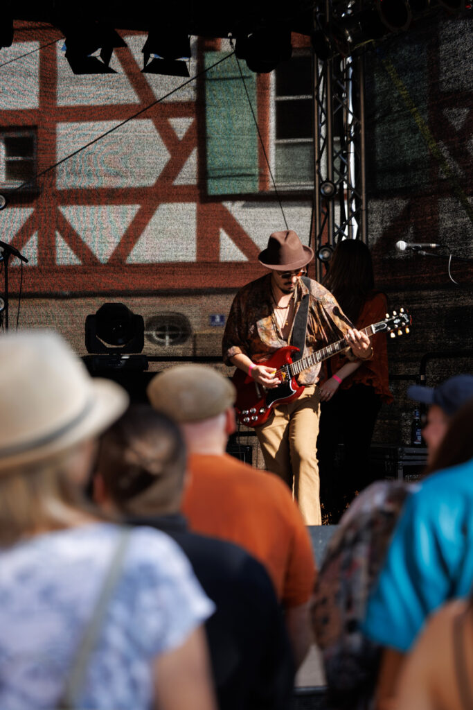 Crimson Roots guitarist performing live
