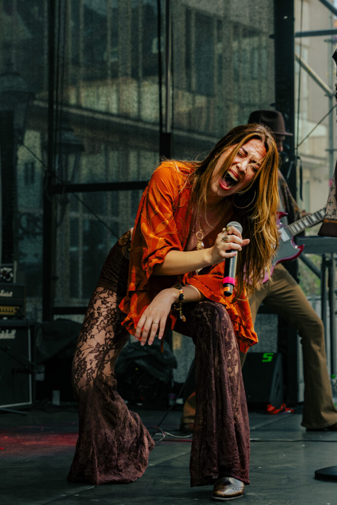 Crimson Roots vocalist singing live on stage
